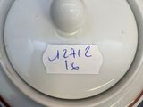 a close up of a white bowl with a label on it