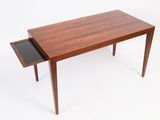 an image of a wooden table with a drawer underneath it
