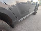 a close up of the side of a car with mud on it