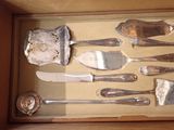 a box with a variety of silverware in it