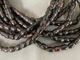 a close up of a bunch of beads on a table
