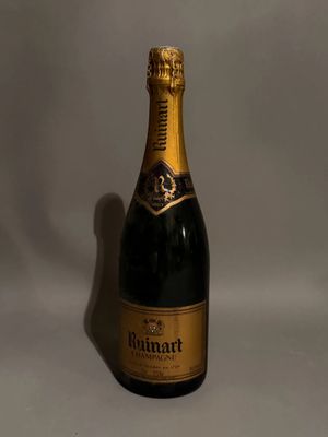 a close up of a bottle of champagne on a white background