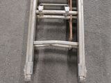 a metal ladder that is laying on the ground