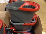 a box with a bunch of buckets and other items in it