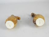 pair of wooden salt and pepper shakers with white tops