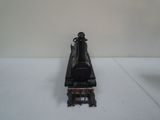 a toy train on a white surface with a white background