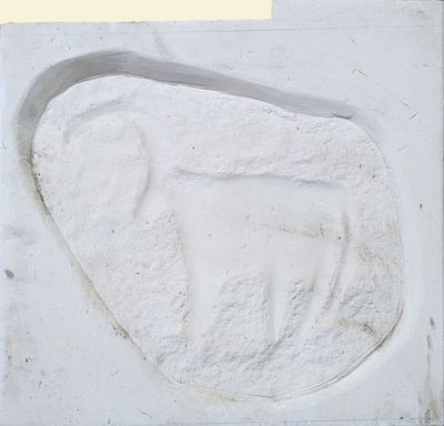 a white sculpture of a bird on a white surface