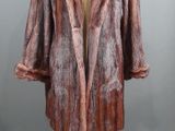 an image of a fur coat on a mannequin stand