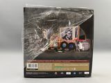 le dos d'une boîte sur lequel figure l'image d'un camion