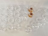 many empty wine glasses sitting on a white surface
