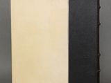 a black and white book sitting on top of a table