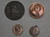 three different types of coins are shown on a gray surface
