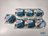 four packages of seresto dog food sitting on top of a table