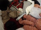 an image of a pile of clothes and clothes on a bed