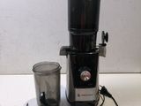 an image of a blender and a cup on a table