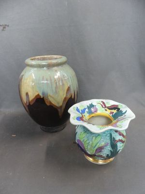 two vases sitting next to each other on a table