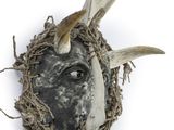 an image of a close up of a mask with antlers on it