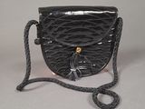 an image of a black purse with a tassel on it