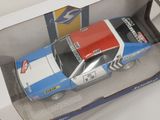 a toy car that is in a box on a table