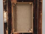 an old photo of a wooden easel with a canvas on it