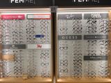 many pairs of glasses on display in a store window