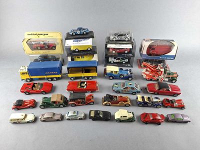 a lot of toy cars and trucks that are on the table