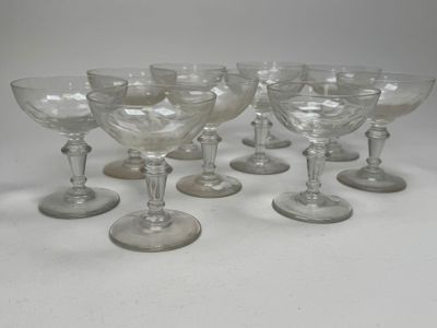six clear wine glasses sitting on top of each other on a table