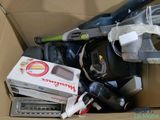 a box full of vacuums and other household items in it