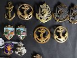 a lot of badges that are on a table