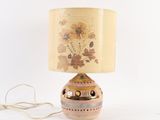 a lamp that is sitting on a table next to a cord