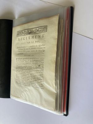 a book with a black cover sitting on a table