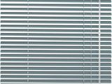 a close up of a window with a metal blind on it