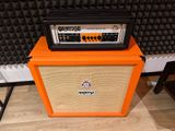 an orange amp sitting on top of an orange amp