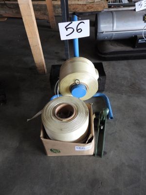 two rolls of yarn sitting in a box on the floor