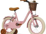 un vélo rose avec un panier à l'arrière