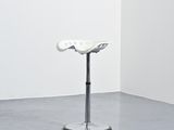an image of a sculpture of a white flower on a pedestal