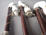 several different types of canes are laid out on a table