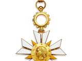 une image représentant une médaille d'or ornée d'une étoile