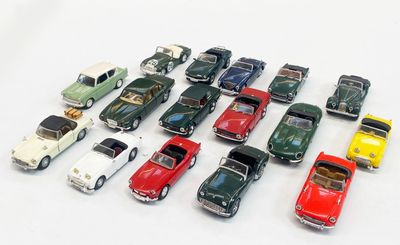 a lot of toy cars that are on a white surface