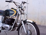 a motorcycle that is parked in front of a wall