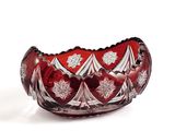 an image of a red glass bowl sitting on top of a white surface
