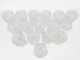 a lot of empty wine glasses on a white surface