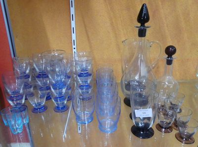 many glasses and a pitcher on the table