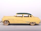 yellow toy car sitting on a white surface with a white background