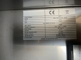 a picture of a sign on the side of a refrigerator