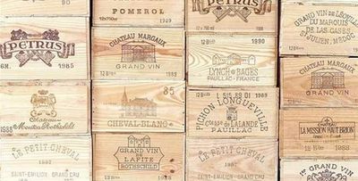 many wooden wine boxes stacked on top of each other
