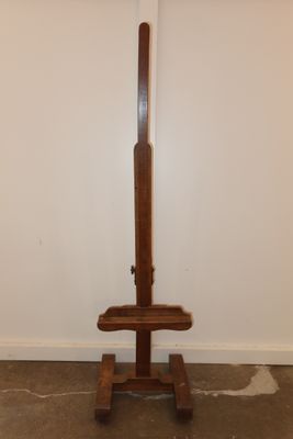 a wooden stand with a baseball bat on top of it