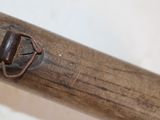 a close up of a wooden baseball bat with a metal handle