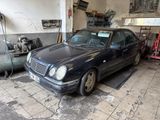 a black car that is parked in a garage