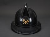 a close up of a helmet with two crossed swords on it